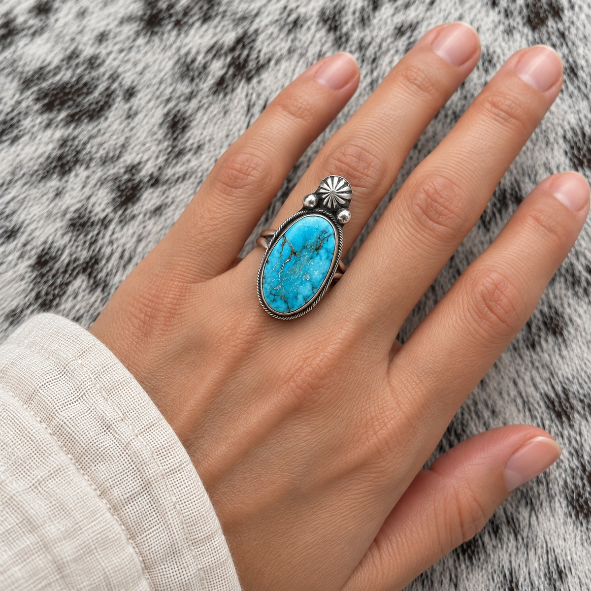 Kingman Turquoise Ring worn around a finger; approximate scale