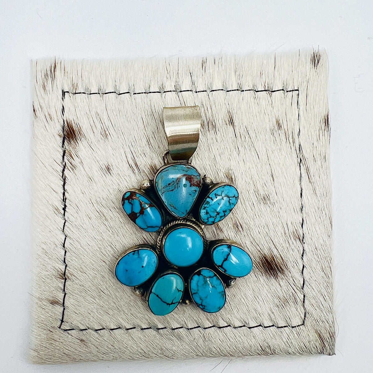 Front view of Bobby Johnson 8-stone turquoise cluster pendant
