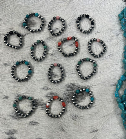Sunset Turquoise Mountain sterling silver bead stretch rings with turquoise, coral, and onyx accents