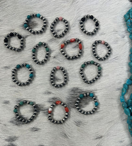 Sunset Turquoise Mountain sterling silver bead stretch rings with turquoise, coral, and onyx accents