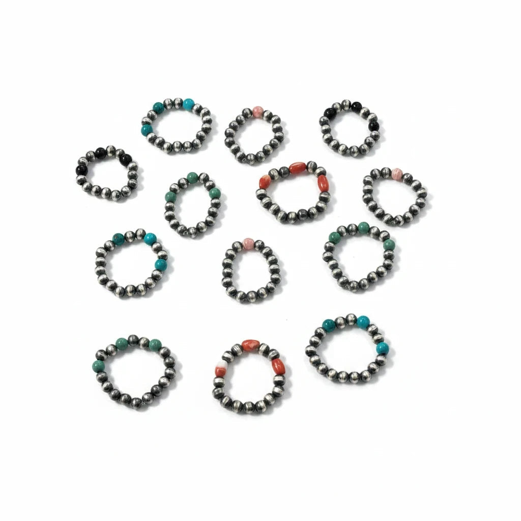 Sunset Turquoise Mountain sterling silver bead stretch rings with turquoise, coral, and onyx accents on white background